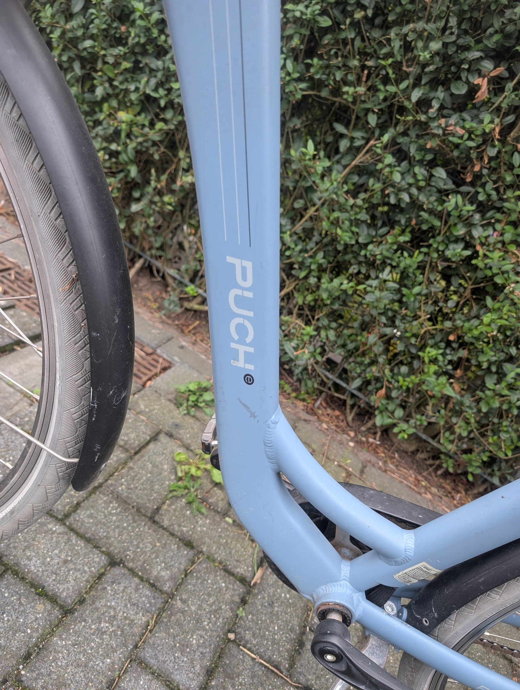 Bequemes Puch Granit City-Fahrrad mit Kindersitz 2